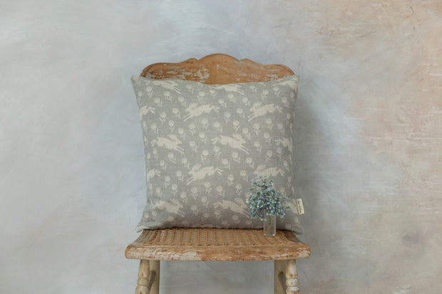 Running Hare White On Grey Linen Cushion